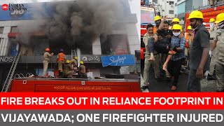 Fire breaks out in Reliance Footprint in Vijayawada's busy Benz Circle; one firefighter injured