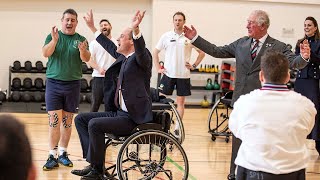 Prince William and Prince Charles play wheelchair basketball at military rehab centre