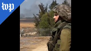 Israeli troops recover the dead near Gaza border