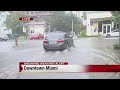 Heavy rain floods streets of downtown Miami