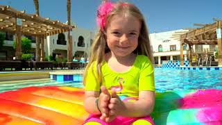 Anabella and Bogdan pretend to play swimming in the pool. Story for children