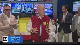 McDonald's recognizes CBS News Miami's Eliott Rodriguez with "In the Crew" varsity jacket