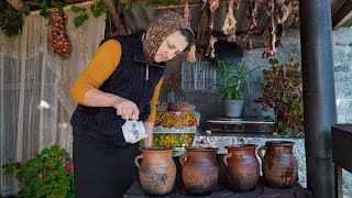 Cooking from Traditional Azerbaijani cuisine Piti in a clay mug - Persimmon dessert with walnuts