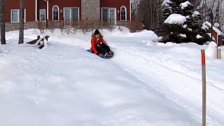 Typical winter activities: tobogganing in the backyard