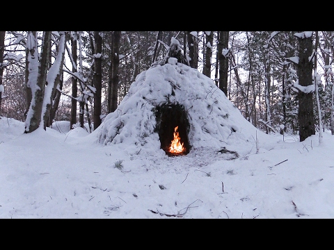 Winter Bushcraft Camp Building - Wikiup, Axe, Knife, Snow Storm Winter Bushcraft Camp Building - Wikiup, Axe, Knife, Snow Storm