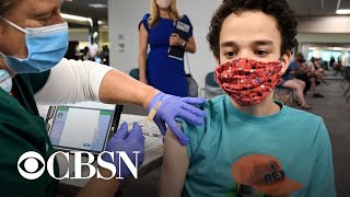 CDC says U.S. can be "cautiously optimistic" as COVID cases and deaths fall