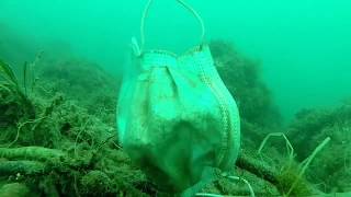 Masks, gloves and other trash on the seabed