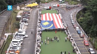 KL Tower hosts 'unboxing' of giant Jalur Gemilang for National Day Celebration