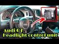 Audi Q7 Headlight control unit location.