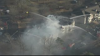 Firefighters continue to combat fire that ripped through Dekalb County apartments