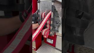Loading a Minute Man hose lay