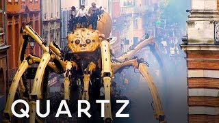 Giant spider and minotaur robot puppets on the streets of France