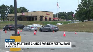 Police controls traffic as new food chain opens