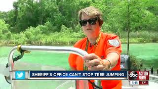 Deputies struggling to stop tree jumping