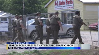 Police search for suspects after they fled from traffic stop