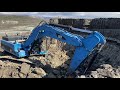 caterpillar 345c excavator loading trucks