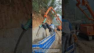 Use a Crawler - Type Pump Vehicle to Pour Concrete for Mountain Slope Retaining Wall