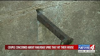 Oklahoma couple in shock after railroad spike stuck in side of house