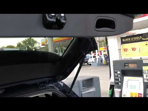 How do you open the rear hatch on a Jeep Cherokee?