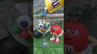 filling m&ms candy on goblet glass while Mr. Red is watching👀 #mnm #shorts #youtubeshorts #trending