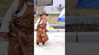 The little Tibetan master came out to have a look as soon as he knew there were guests com