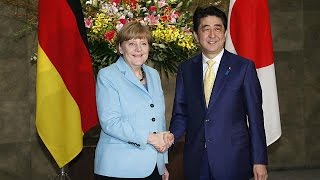 Visiting Merkel reminds Japan to confront wartime past