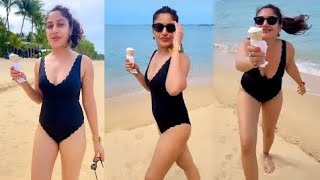 TV Actress Surbhi Chandna In Black Swimsuit Enjoying With ICE-CREAM on The Beach