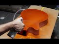 Spray painting guitar with candy and flake