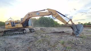 Take a look at the new Cat 323 GC excavator working on leveling the durian plantation.