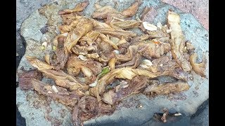 Cooking beef internal part (Lanit-lanit) on top of a hot rock!