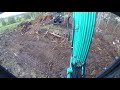 kobelco 5.5 ton excavator with log grabs clearing scrub