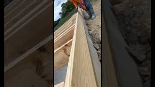 Installing floor joists for new home construction near Elyria Ohio