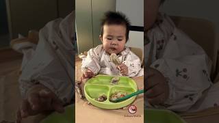 The child eats the chicken leg with great enthusiasm, Baby eating food.#shorts