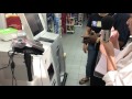 A customer at Food-Joy mini-mart using the self-checkout counter