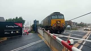 57310 and 57306 passes by Deal level crossing