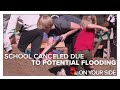 School canceled in Pacific, kids and adults bagging sand instead