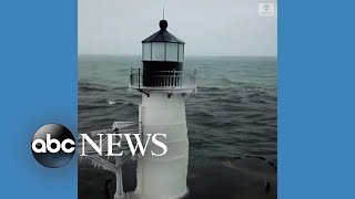 Lighthouse covered in ice amid plunging temperatures