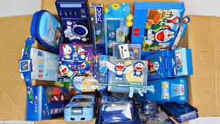 Box full of blue stationery - rc plane, Doraemon, cheating pen, pencil box, pencil sharpner, crayons