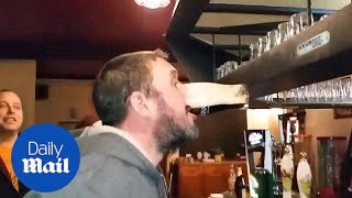 Man shows some serious skills at downing pint in amazing pub trick - Daily Mail