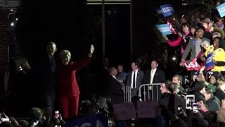 Clintons, Obamas unite for huge election-eve rally