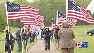 Cascade of taps honors heroes in Veterans Memorial Cemetery