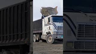 truck reversing to load 7500 of gravel