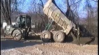 Dump Truck Moxy at Work Dumping River Gravel – Danske Soldater