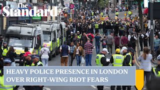 UK riots: heavy police presence in London over fears right-wing activity could spark chaos