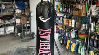 Fabricating and welding, a punching bag stand out from scrap steel