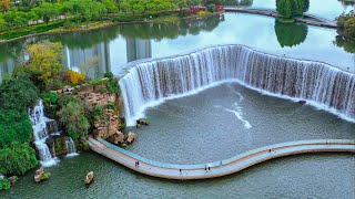 Relaxing stroll along Asia's largest artificial waterfall | Kunming City Waterfall Park