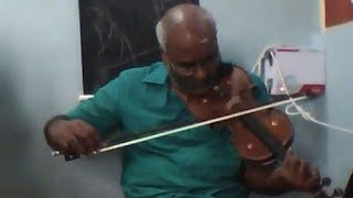 MM Keeravaani playing violin