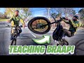 TEACHING BRAAP VLOGS HOW TO WHEELIE SURRON X!!