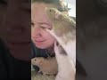 rats licking owner face as she sits still making her laugh