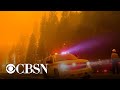 Western wildfires force evacuations and destroy homes